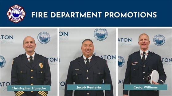 Three fire department personnel in uniforms stand in front of a backdrop featuring the department's logo. Each is smiling, conveying pride. Text above reads "Fire Department Promotions," with names displayed below each individual: Christopher Hunecke, Jacob Renteria, Craig Williams.