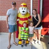 Family with Sparky the Fire Dog