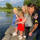 police officer fishing with kids