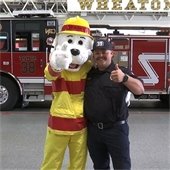 Firefighter with Sparky the Fire Dog