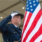 Officer Saluting Flag