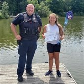 Officer with Kid Fishing