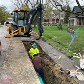Crew Members Working on Road Drainage Project