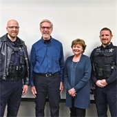 Two Police Officers with Two Residents in a Group Photo