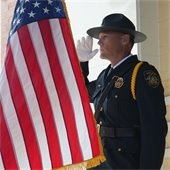 Police Officer Saluting the Flag